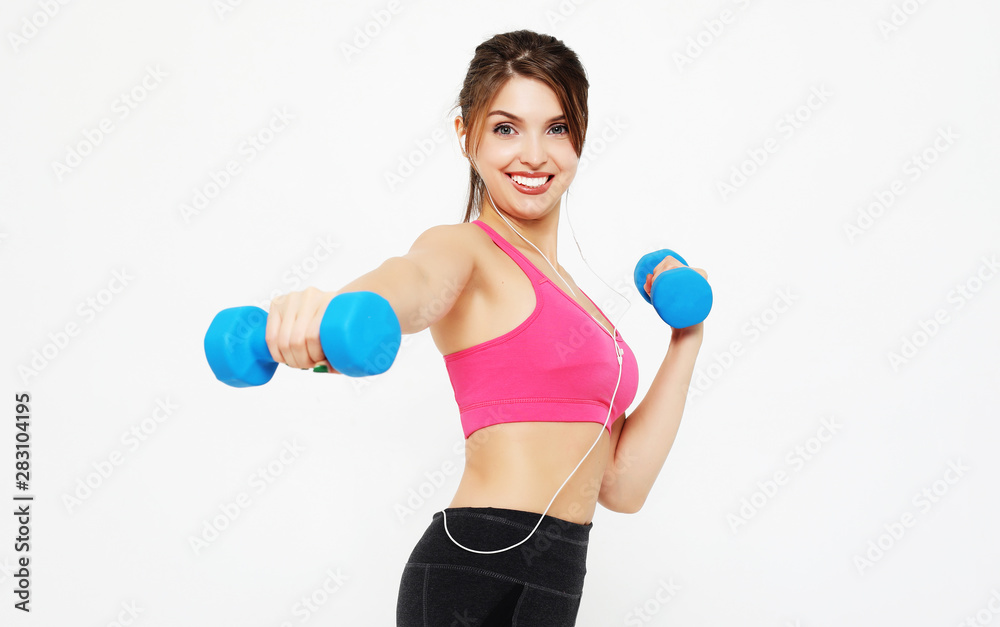 sport and people concept: Young girl athlete, fitness with dumbbells sport and people concept: Young girl athlete, fitness with dumbbells