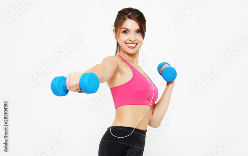 sport and people concept: Young girl athlete, fitness with dumbbells