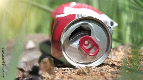 Beer can lies in forest, abuse of environment, environmental pollution photo