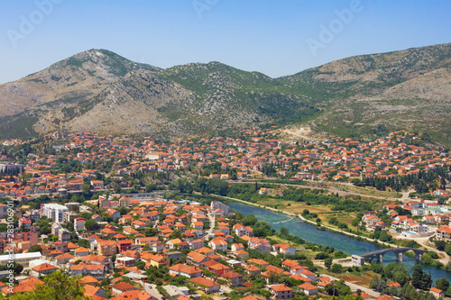 View of Trebinje city and Trebisnjica river on sunny summer day. Bosnia and Herzegovina