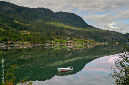 Beautiful view of a Norwegian fjord and its reflection, near the city of Kaupanger, Sogn og Fjordane, Norway. photo