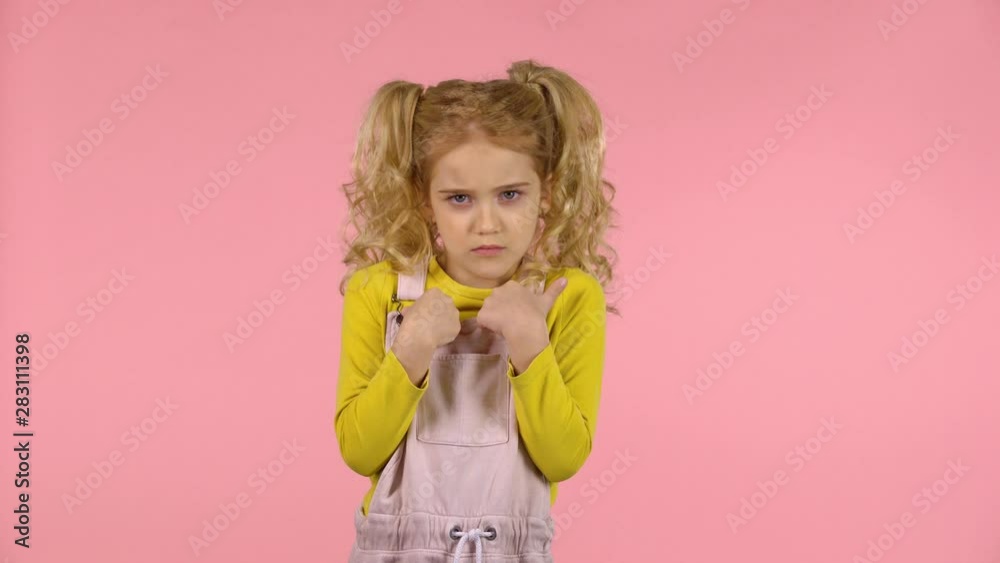 Beautiful young girl is pointing on herself showing No Beautiful young girl is pointing on herself showing No