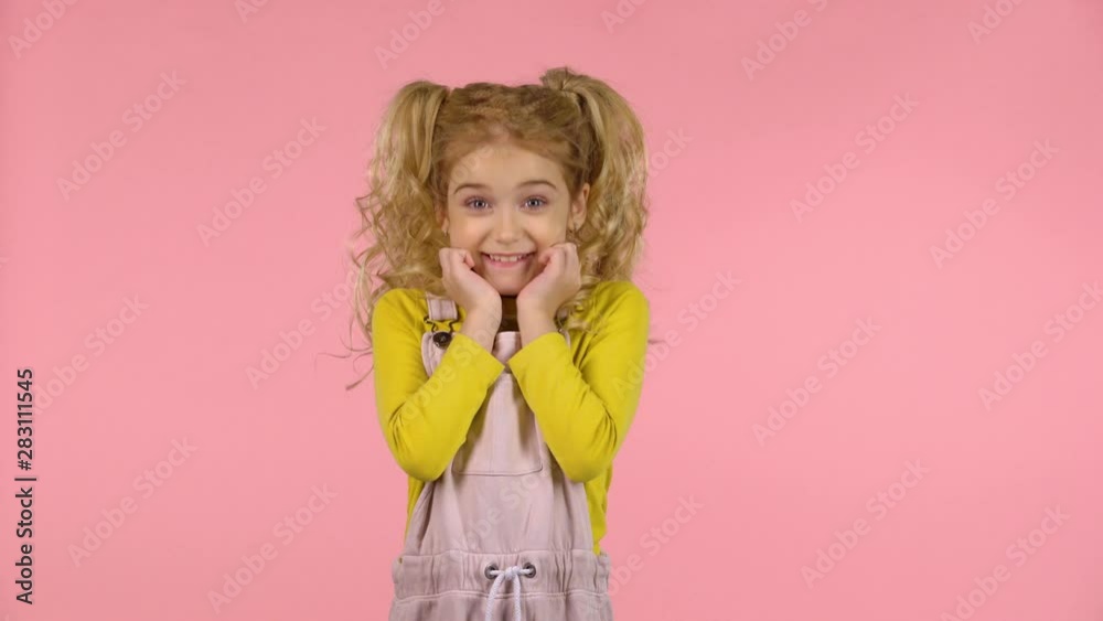 Little pretty girl is pointing on herself and smiling Little pretty girl is pointing on herself and smiling