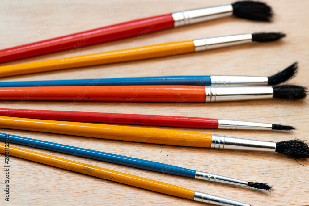 many brushes of different sizes to work on canvas and wood many brushes of different sizes to work on canvas and wood