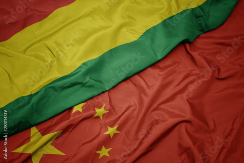 Wall Mural waving colorful flag of china and national flag of bolivia.
