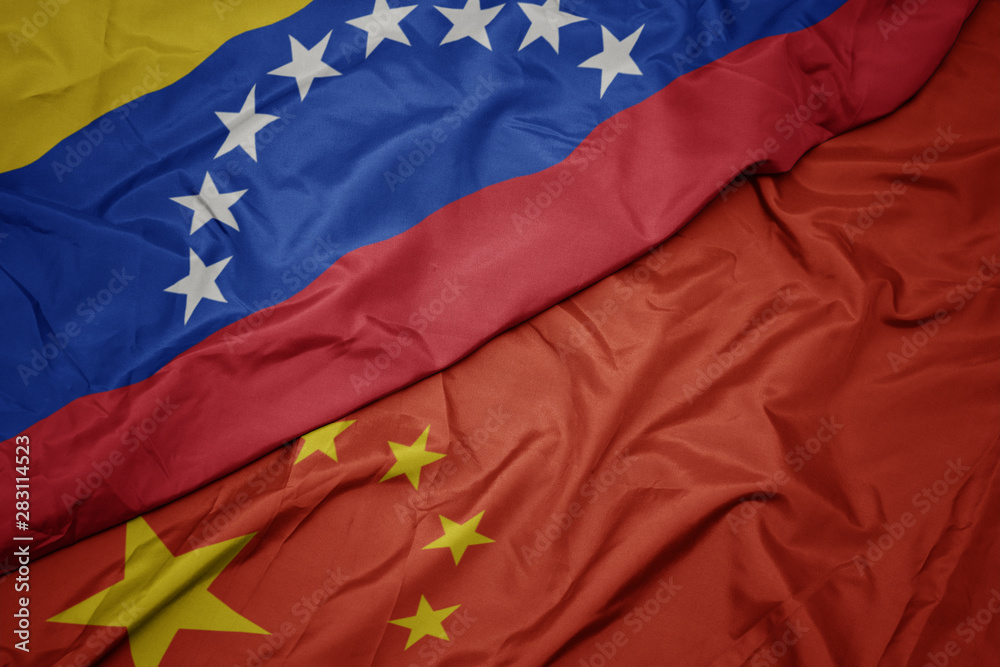 waving colorful flag of china and national flag of venezuela. waving colorful flag of china and national flag of venezuela.