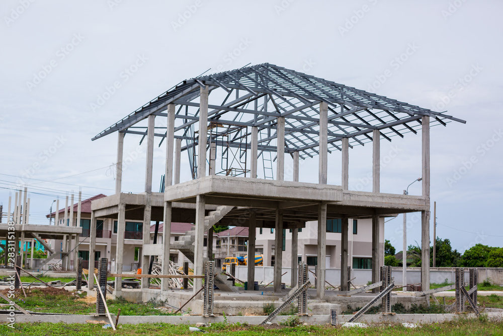 Home under construction using steel frames against. New residential construction home metal framing against. Building site with new homes under construction in Thailand. Home under construction using steel frames against. New residential construction home metal framing against. Building site with new homes under construction in Thailand.