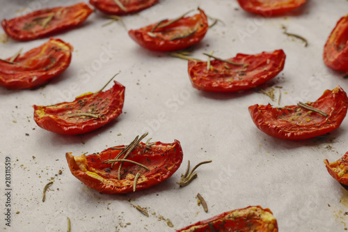 Sun dried tomatoes on light background