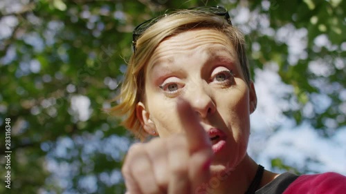 Female POV on a video call on her phone using sign language to arrange an outing with a friend