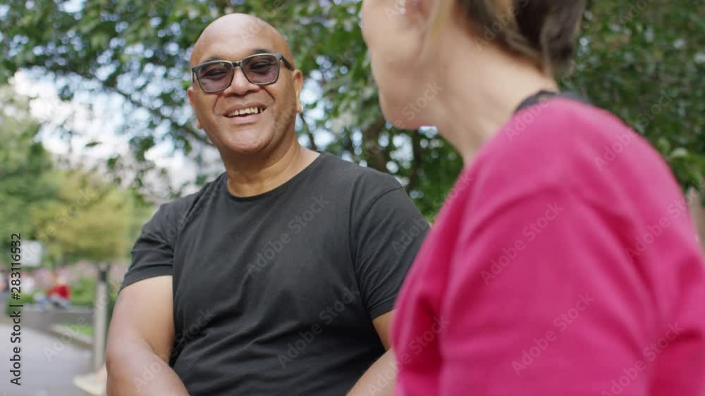 Two people engaged in positive conversation using sign language