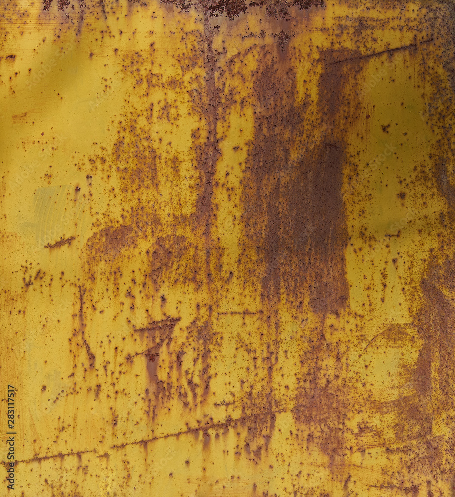 Old yellow painted wall with rust texture. Grunge rusted metal background.