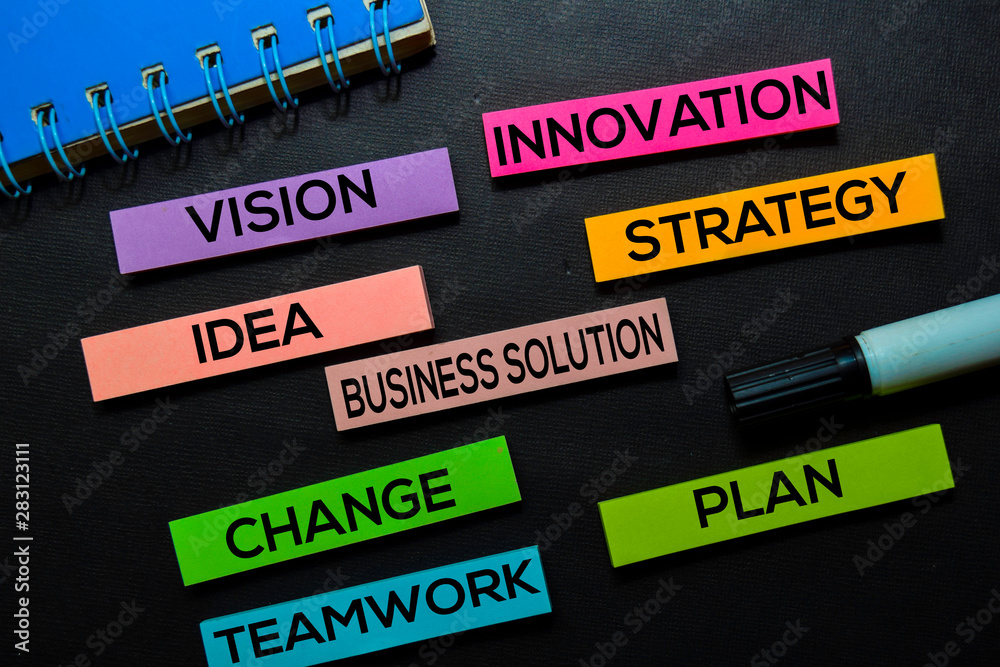 Vision, Innovation, Idea, Business Solution, Strategy, Change, Teamwork, Plan text on sticky notes isolated on Black desk. Mechanism Strategy Concept Vision, Innovation, Idea, Business Solution, Strategy, Change, Teamwork, Plan text on sticky notes isolated on Black desk. Mechanism Strategy Concept