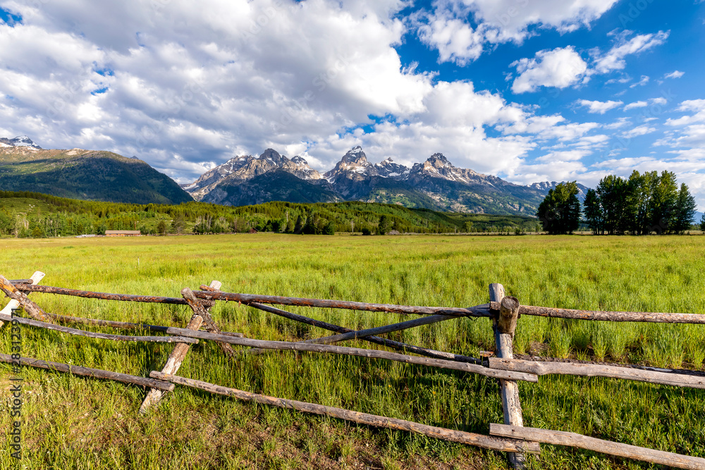 Split Rail Fence with Mountains and Clouds
