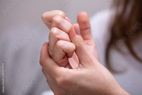 Woman Cracking Their Knuckles photo