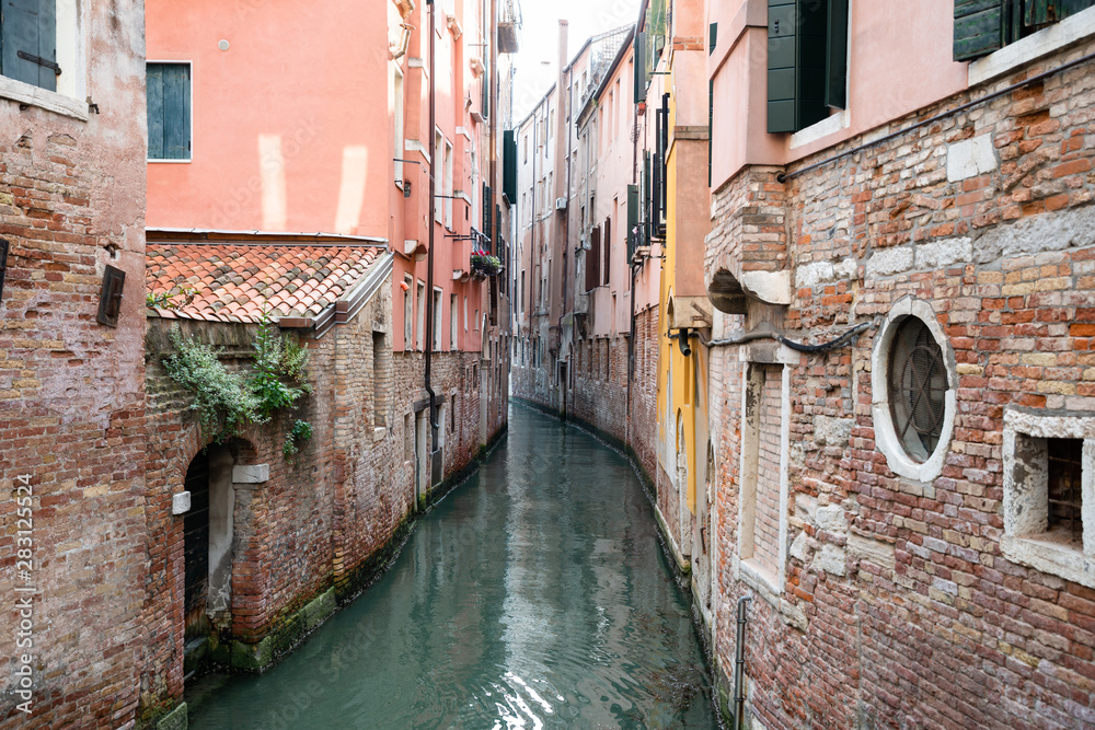 Narrow Canal In Venice, Italy
