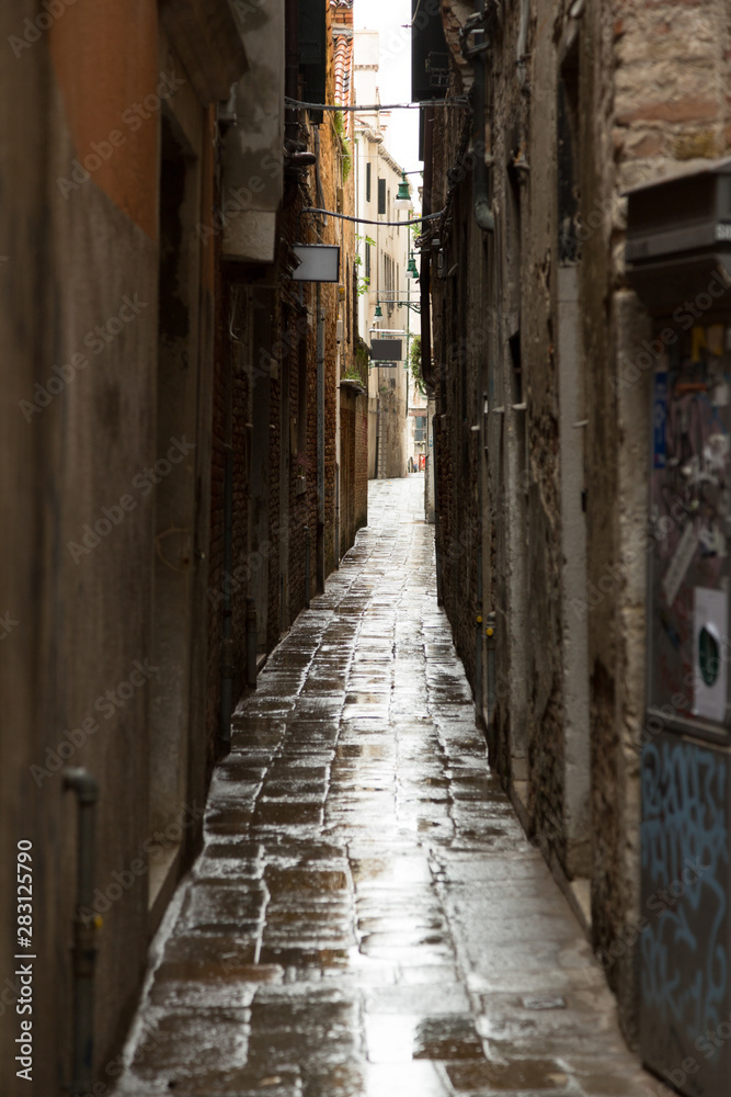 Narrow street a rainy day in Venice