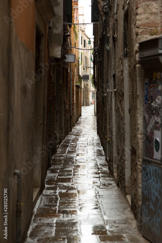 Narrow street a rainy day in Venice