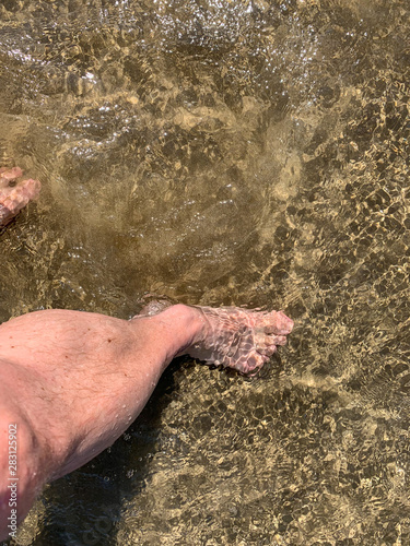 Man walking into the ocean