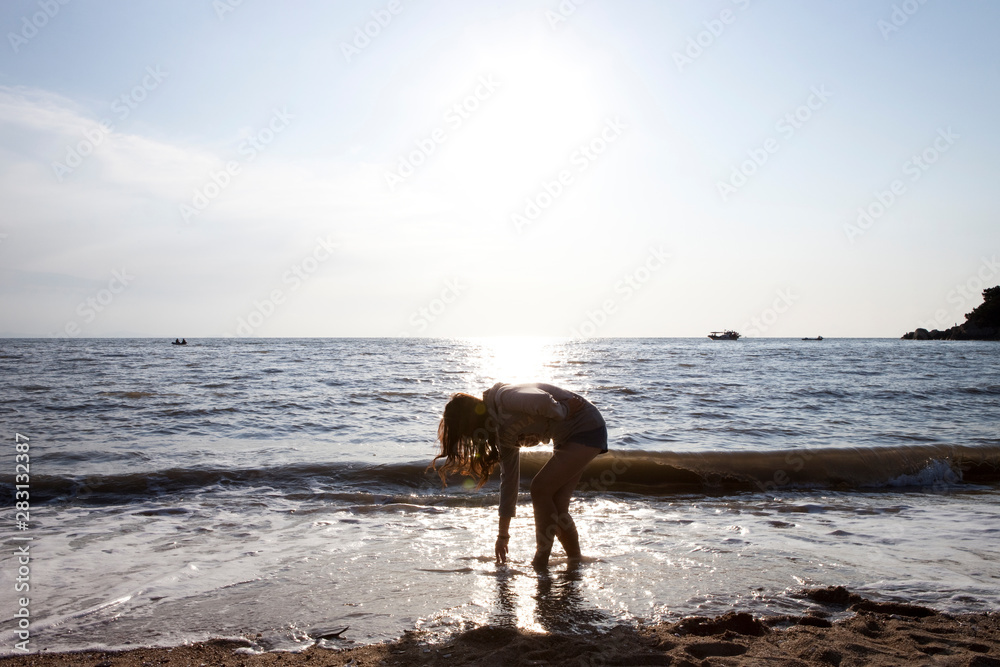Young woman on a trip to the Korean sea.