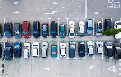 Aerial view on the cars on park place. View from drone on the carpark. Transportation background - image