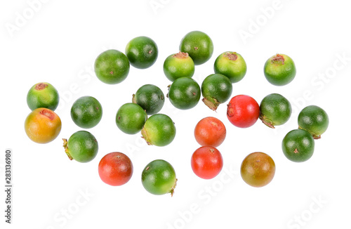 Fresh ripe and raw peppercorns isolated on white background.