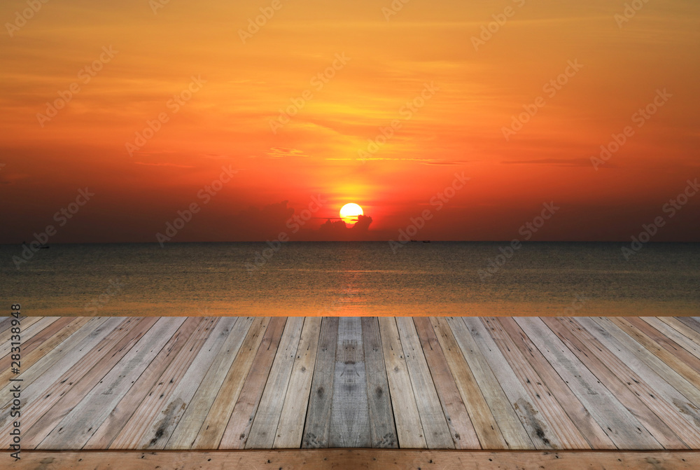 Wood table top on sunset background Wood table top on sunset background