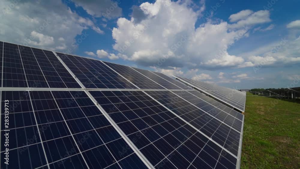 Photovoltaic solar panel on the modern electric power plant. Close view of innovative source of energy. Solar farm. Motion camera back. Photovoltaic solar panel on the modern electric power plant. Close view of innovative source of energy. Solar farm. Motion camera back.