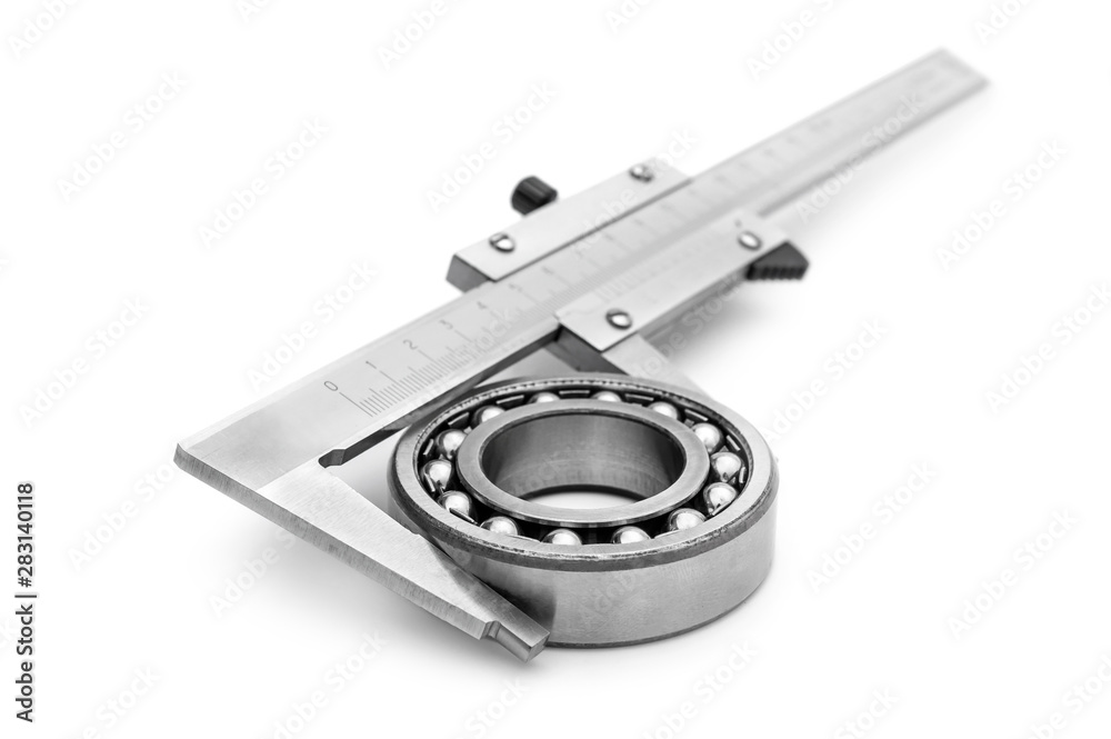 Calipers with metal bearing on white.