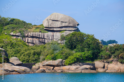 Seascape with huge pink granite boulders near Plumanach. The coast of pink granite is a unique place in Brittany. France photo