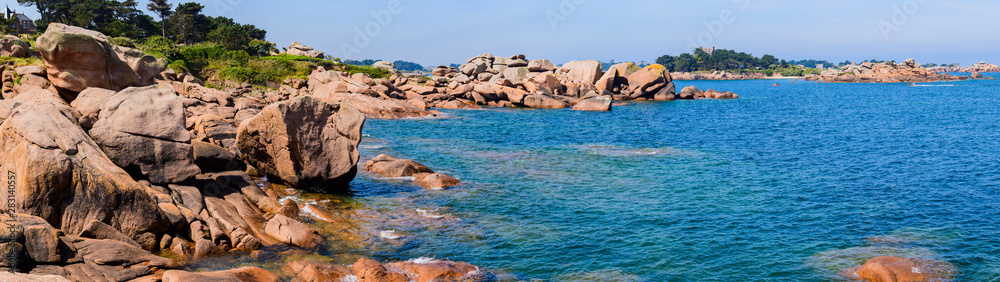 Sea Panoramic Landscape with huge pink granite boulders near Plumanach. The coast of pink granite is a unique place in Brittany. France