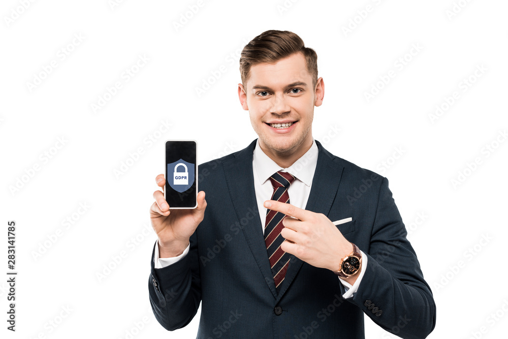 happy businessman in suit pointing with finger at smartphone with gdpr lettering on screen isolated on white happy businessman in suit pointing with finger at smartphone with gdpr lettering on screen isolated on white