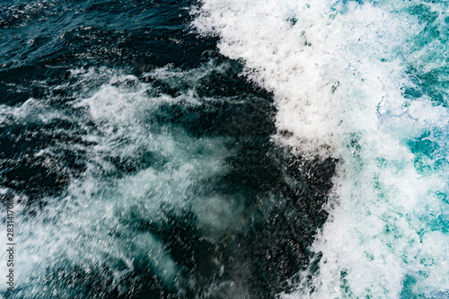 background picture of raging waves in blue fresh lake water