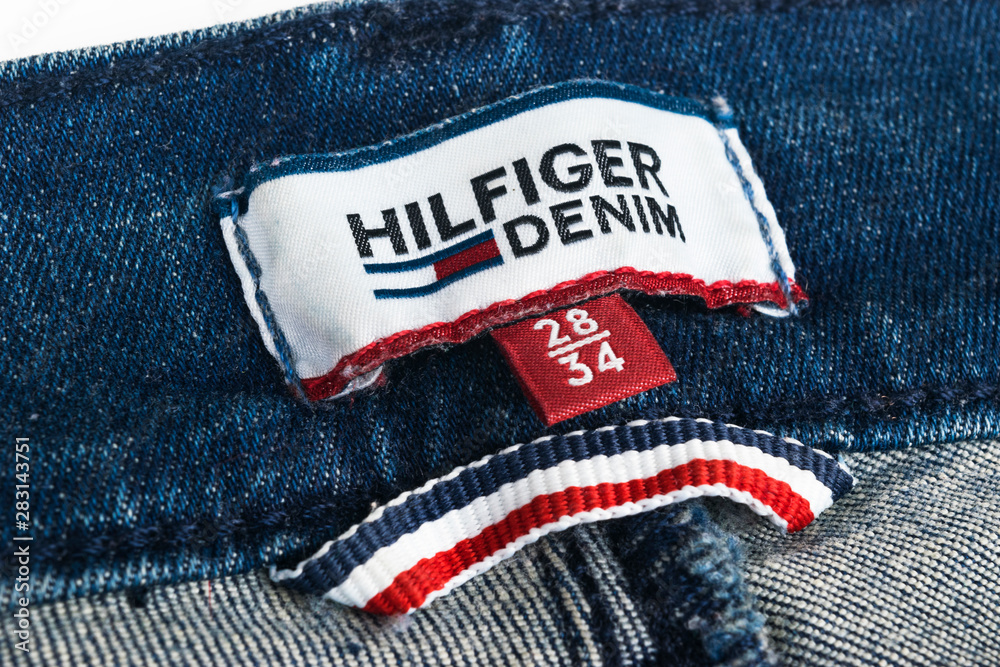 Sankt-Petersburg, Russia, October 9, 2017: Closeup of Tommy Hilfiger label  on blue jeans. Tommy Hilfiger is lifestyle brand. Hilfiger Denim. Tommy  Hilfiger blue jeans detail Stock Photo | Adobe Stock