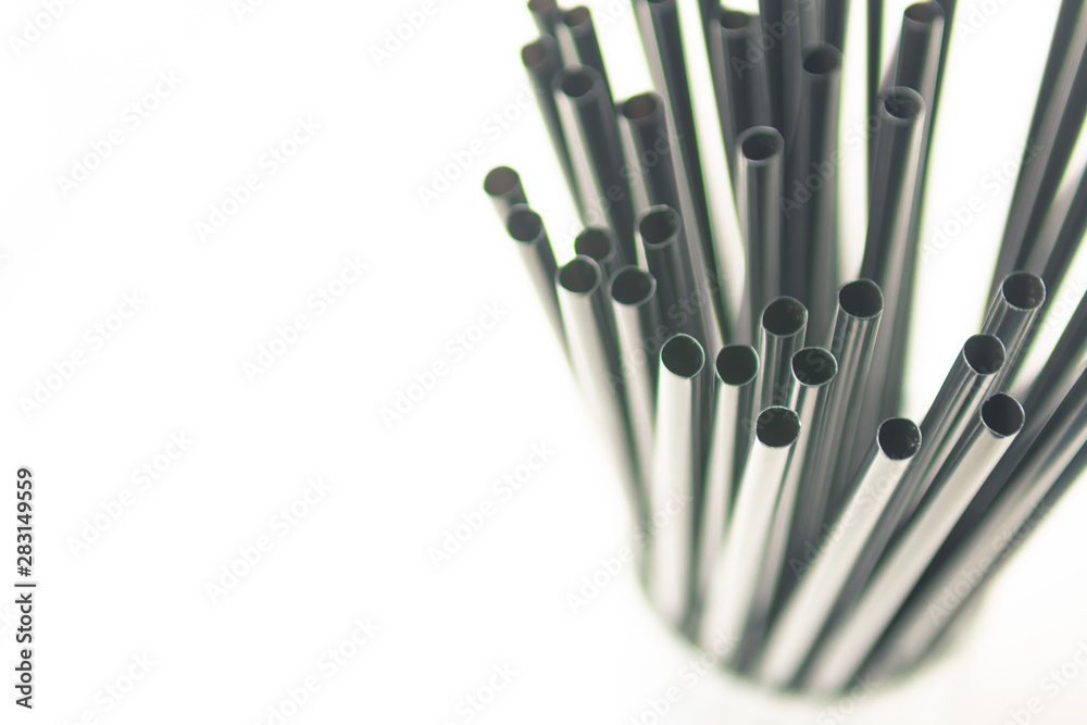 Bundle of plastic drinking straws, left, close up Bundle of plastic drinking straws, left, close up