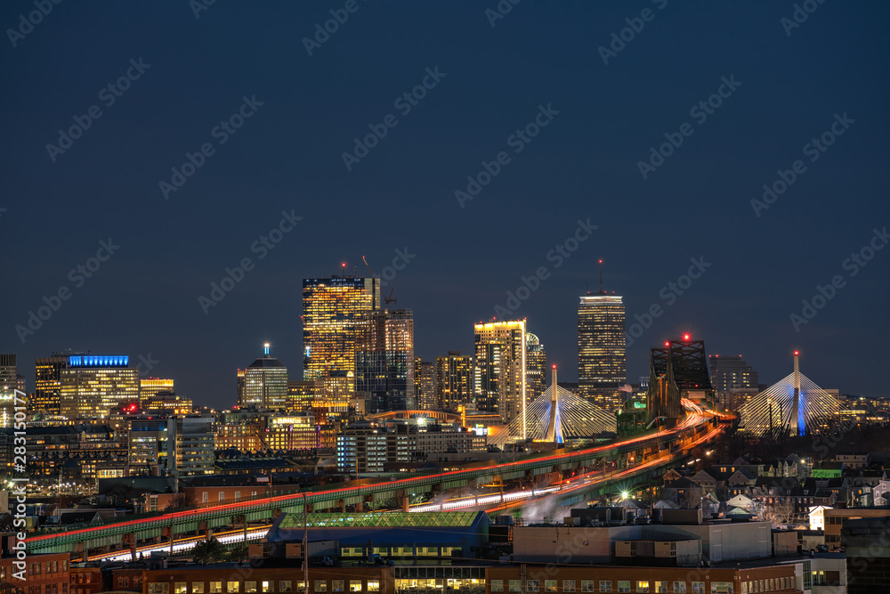 Scene of Boston skyline which can see Zakim Bridge and Tobin Bridge with express way over the Boston Cityscape at twilight time, USA downtown skyline, Architecture and building with tourist concept
