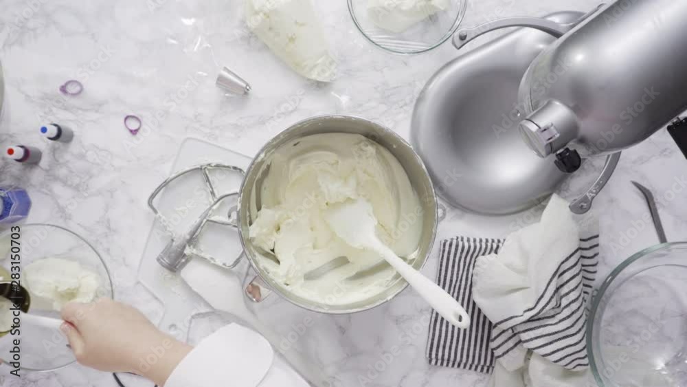 Step by step. Mixing ingredients in standing kitchen mixer to make buttercream frosting. Step by step. Mixing ingredients in standing kitchen mixer to make buttercream frosting.