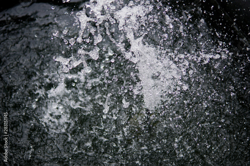 Water Splash on black background.Stylish water splash. Isolated on black background. © Pattadis