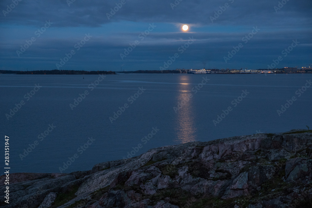 Early dawn blue sky and moon on the Suomenlinna, Finland Early dawn blue sky and moon on the Suomenlinna, Finland