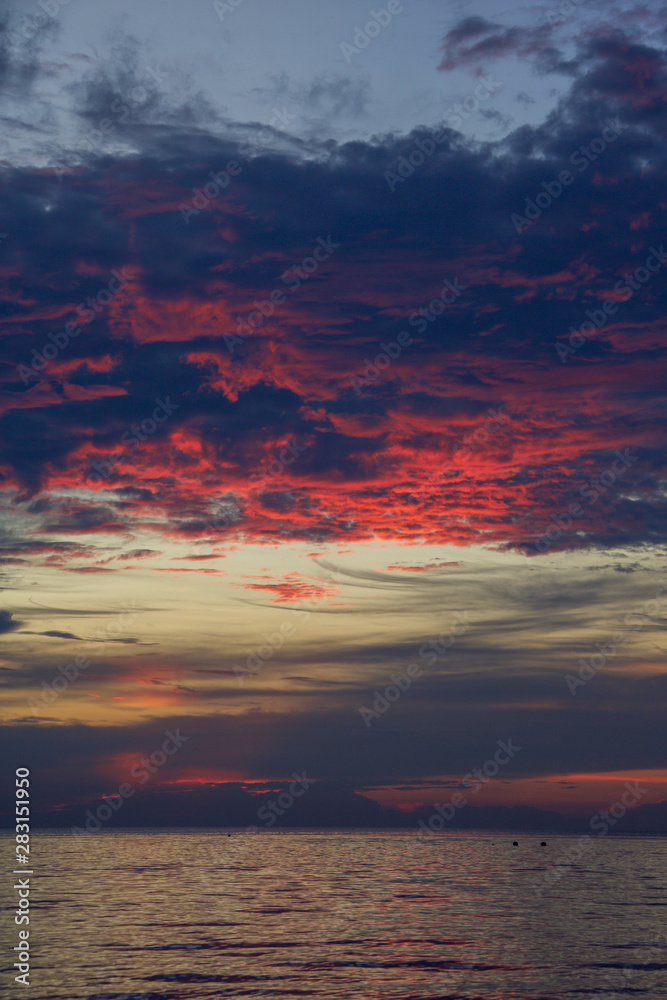 dramatic sky at sunset on the sea in a tropical island dramatic sky at sunset on the sea in a tropical island