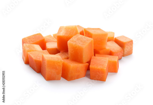 Pile of fresh carrot cubes isolated on white