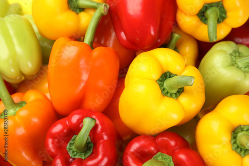 Fresh ripe colorful bell peppers as background, top view
