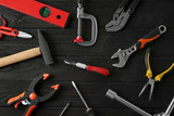 Set of repair tools on dark wooden background, flat lay