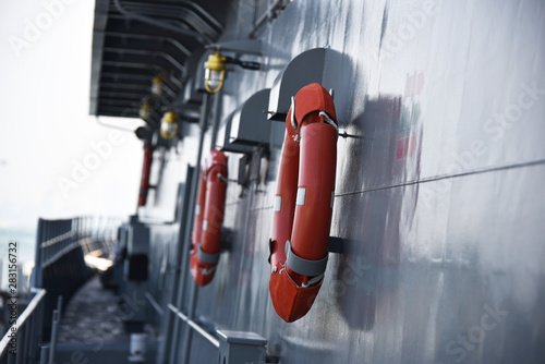 orange lifebuoy ready for use in case of emergency