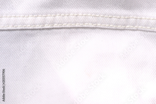 White jeans jacket texture close up. Denim background