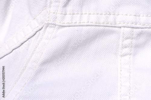 White jeans jacket texture close up. Denim background