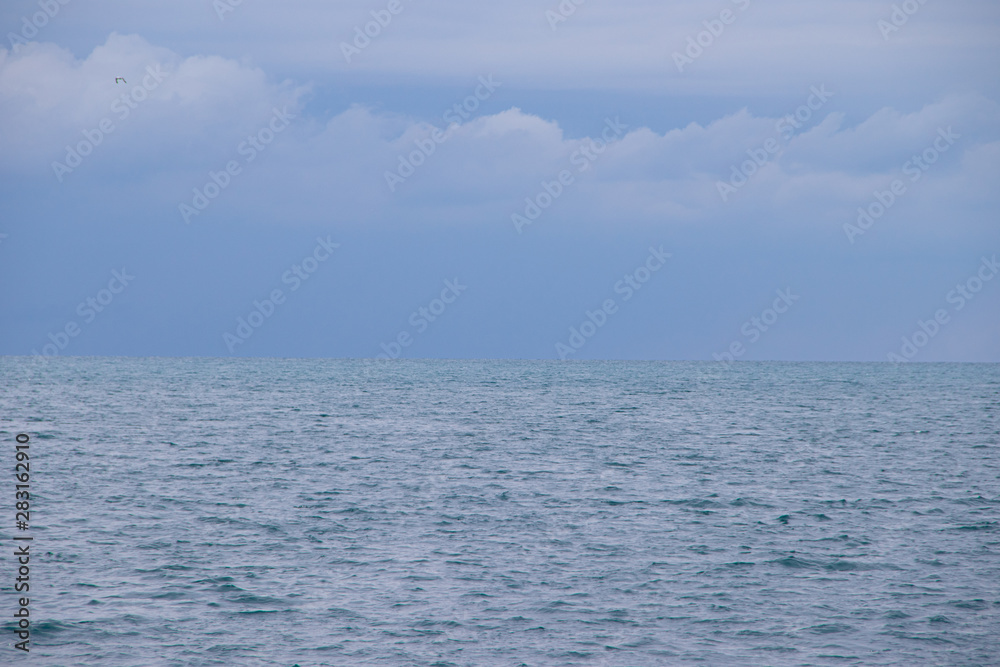 Obraz premium Sea in cloudy weather. Calm sea. View of the sea from a height. Anapa district. The vastness of Russia. Black Sea . Summer landscape sea and sky