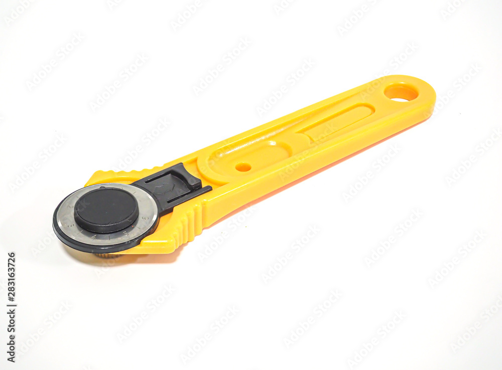 Rotary cutter for garment or textile on white background