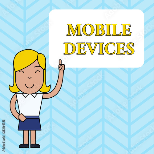 Conceptual hand writing showing Mobile Devices. Concept meaning A portable computing device like smartphone tablet computer Woman Standing with Raised Left Index Finger Pointing at Box photo