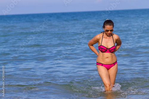Woman and bikini pink sexy on beach