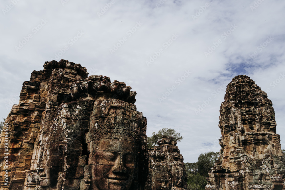 Large Ankgor Thom statues in the shape of ancestral faces in Cambodia - Unesco World Heritage in 1992